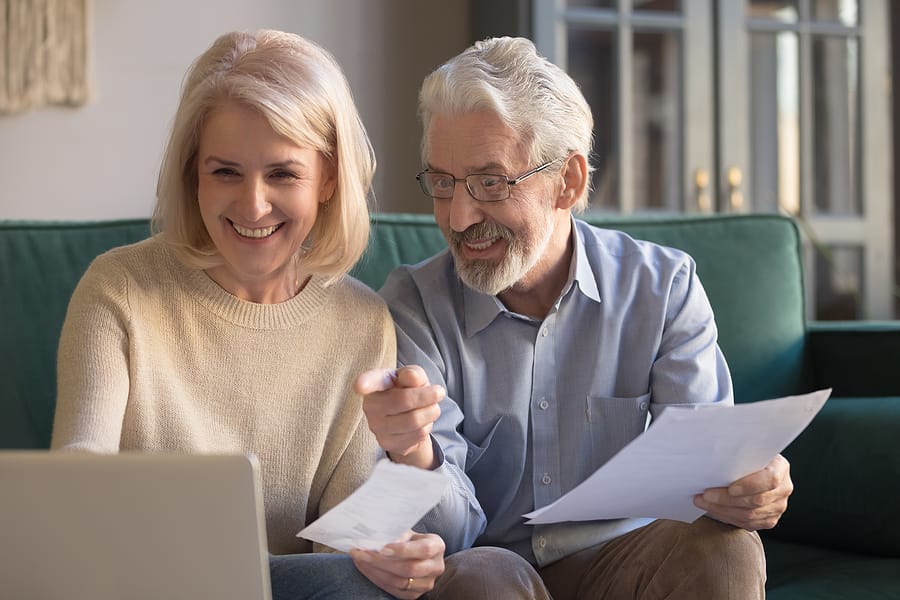 Happy Old Couple Paying Domestic Bills Online Using Computer App