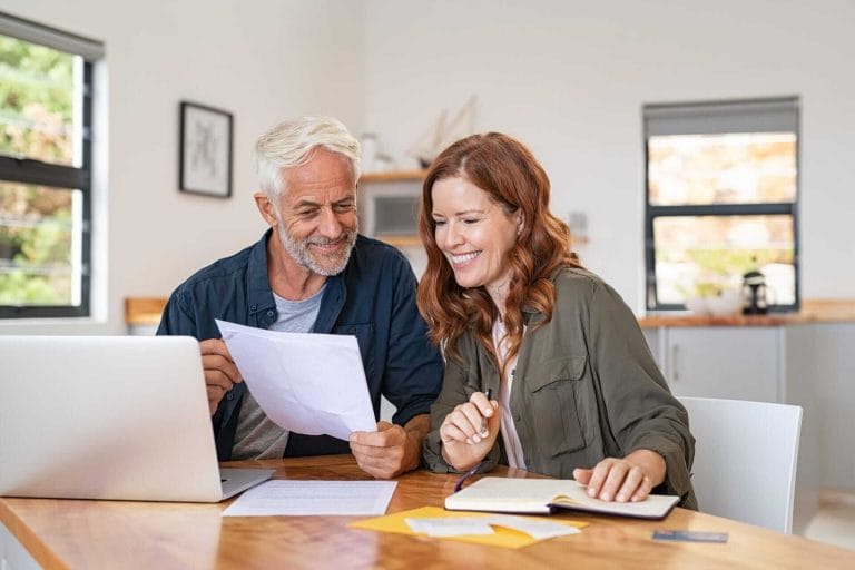 bigstock-Mature-smiling-couple-sitting--365289844